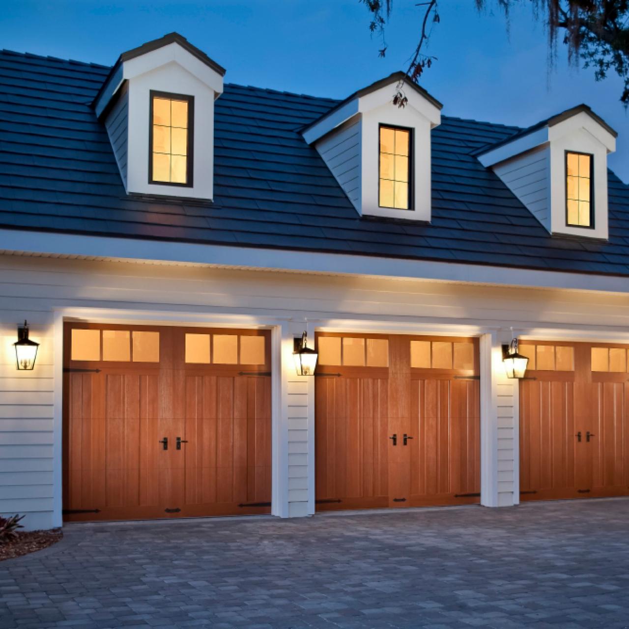 A row of garages with three lights on each of them