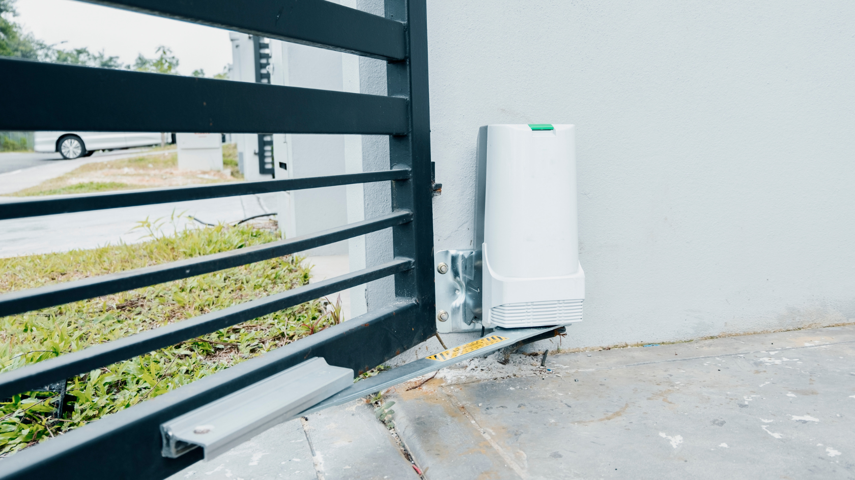 A white water heater sitting on the side of a building