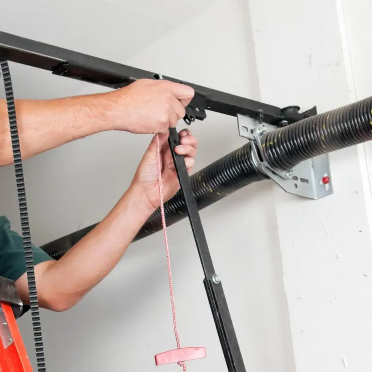 A man working on a pipe in a room