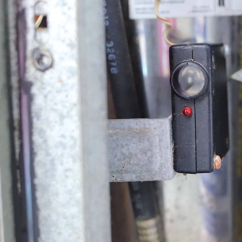 A close up of a button on a door handle