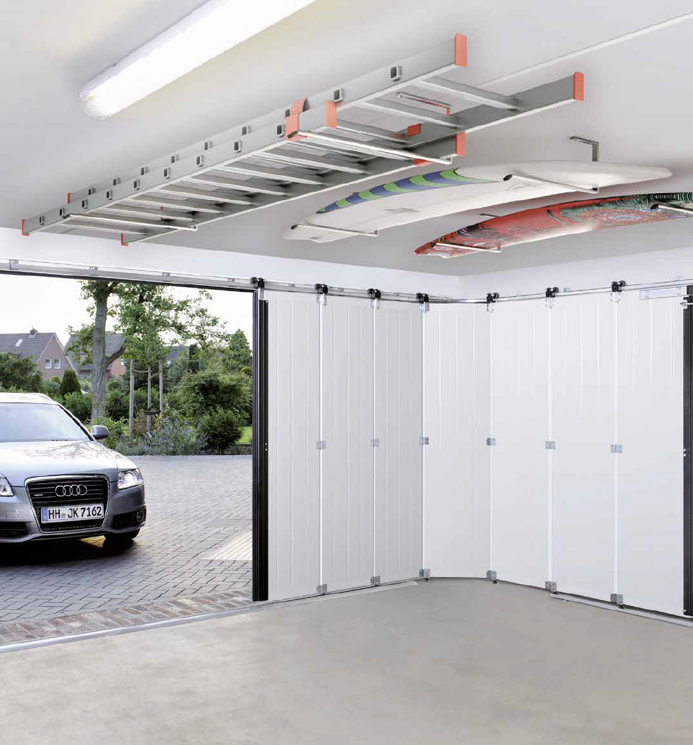 A car is parked inside of a garage